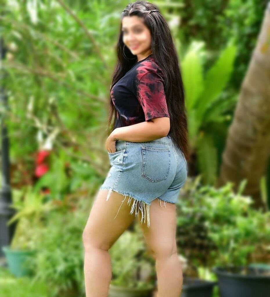 Sexy girl showing off her curvy Indian Physique in ripped Shorts