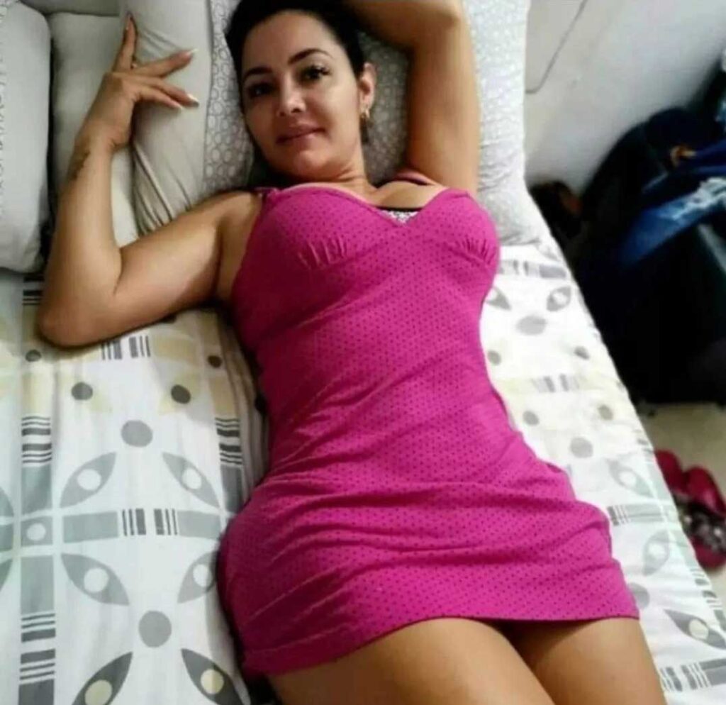 sexy girl in purple short nighty, lying in bed