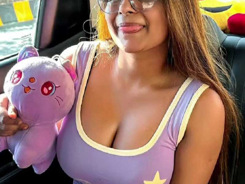 a cute girl showing her sift toy and deep cleavage