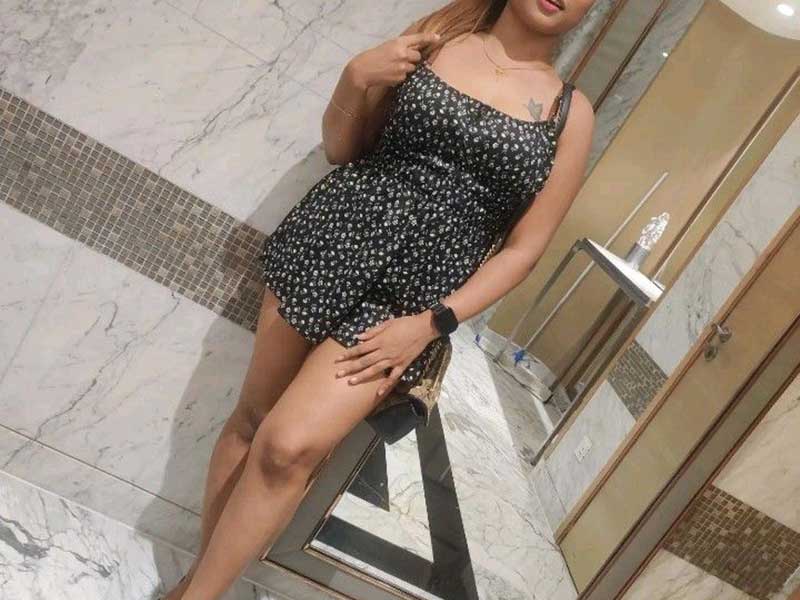 a beautiful sexy girl in short dress in a hotel lobby