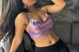 sweet young babe in glossy vilolet top
