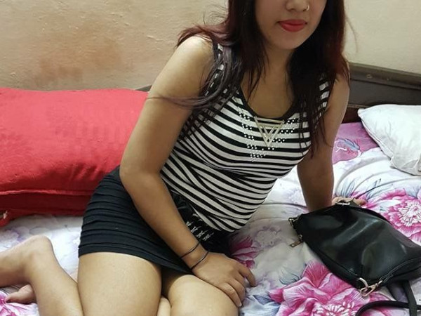 girl sitting in bed